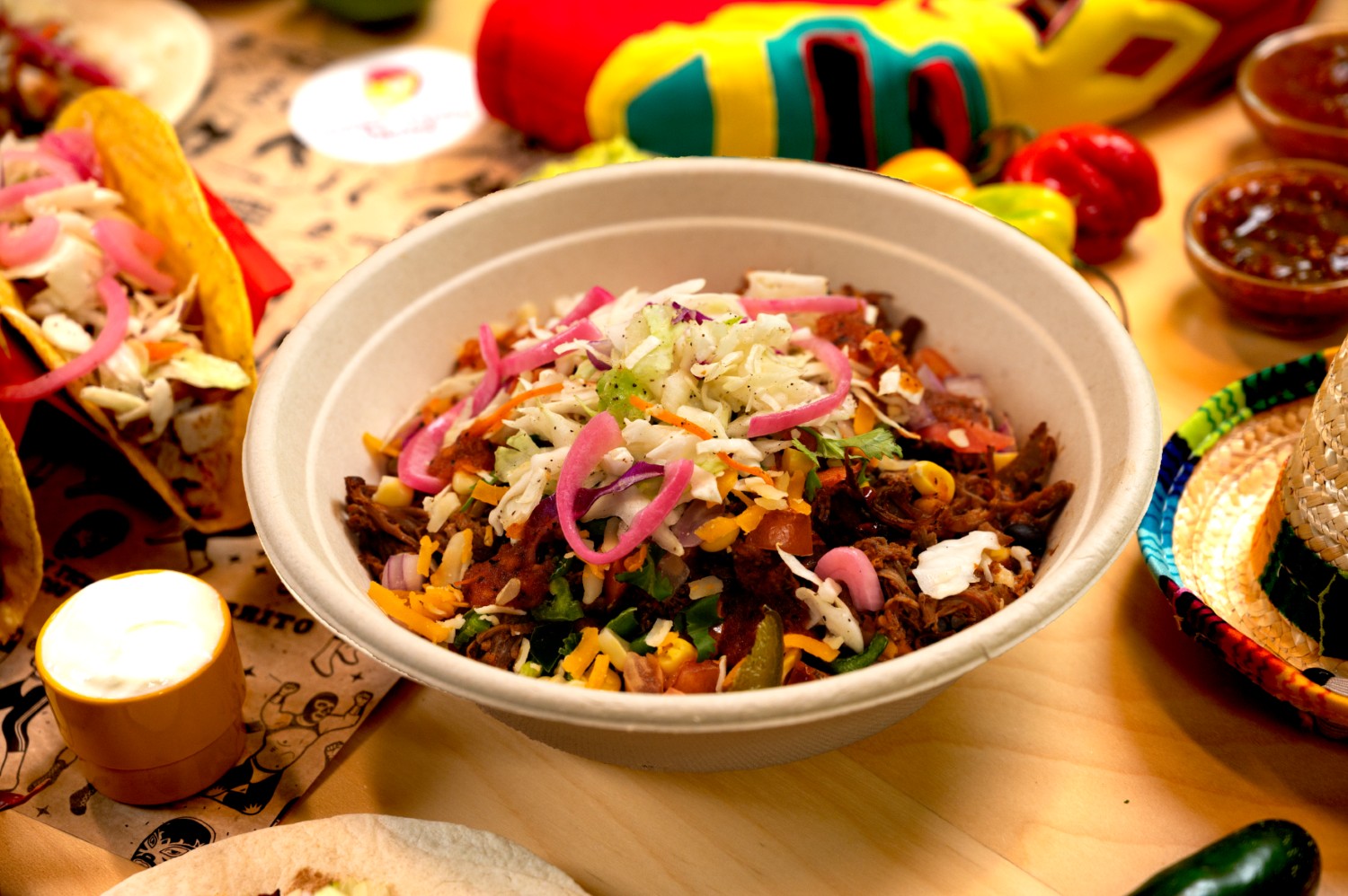 A full Ricky Ticky Tacos meal laid out with drinks and salsa.